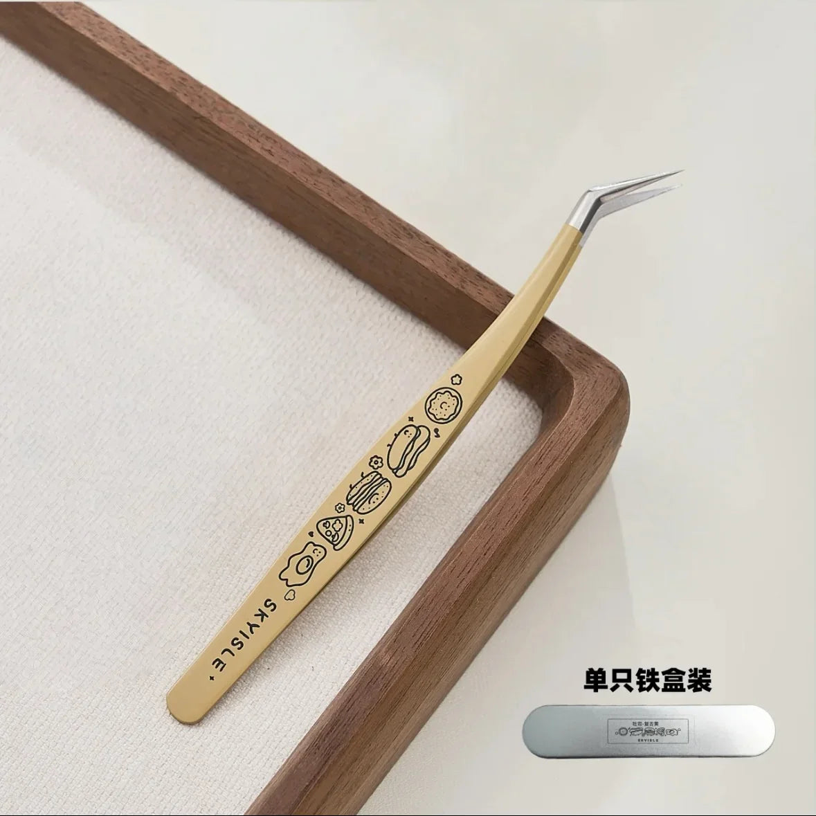 Yellow precision tweezer with cartoon designs and angled tip, ideal for crafting or sticker use