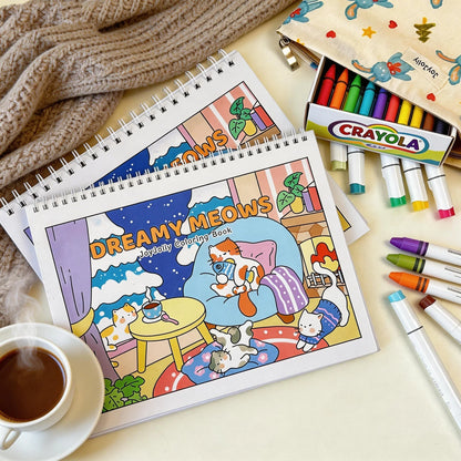Dreamy Meows coloring book with cute cat illustrations, markers, and cozy setup