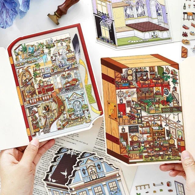 Hands holding cozy miniature European manor scene stickers with detailed rooms, perfect for journaling and scrapbooking.
