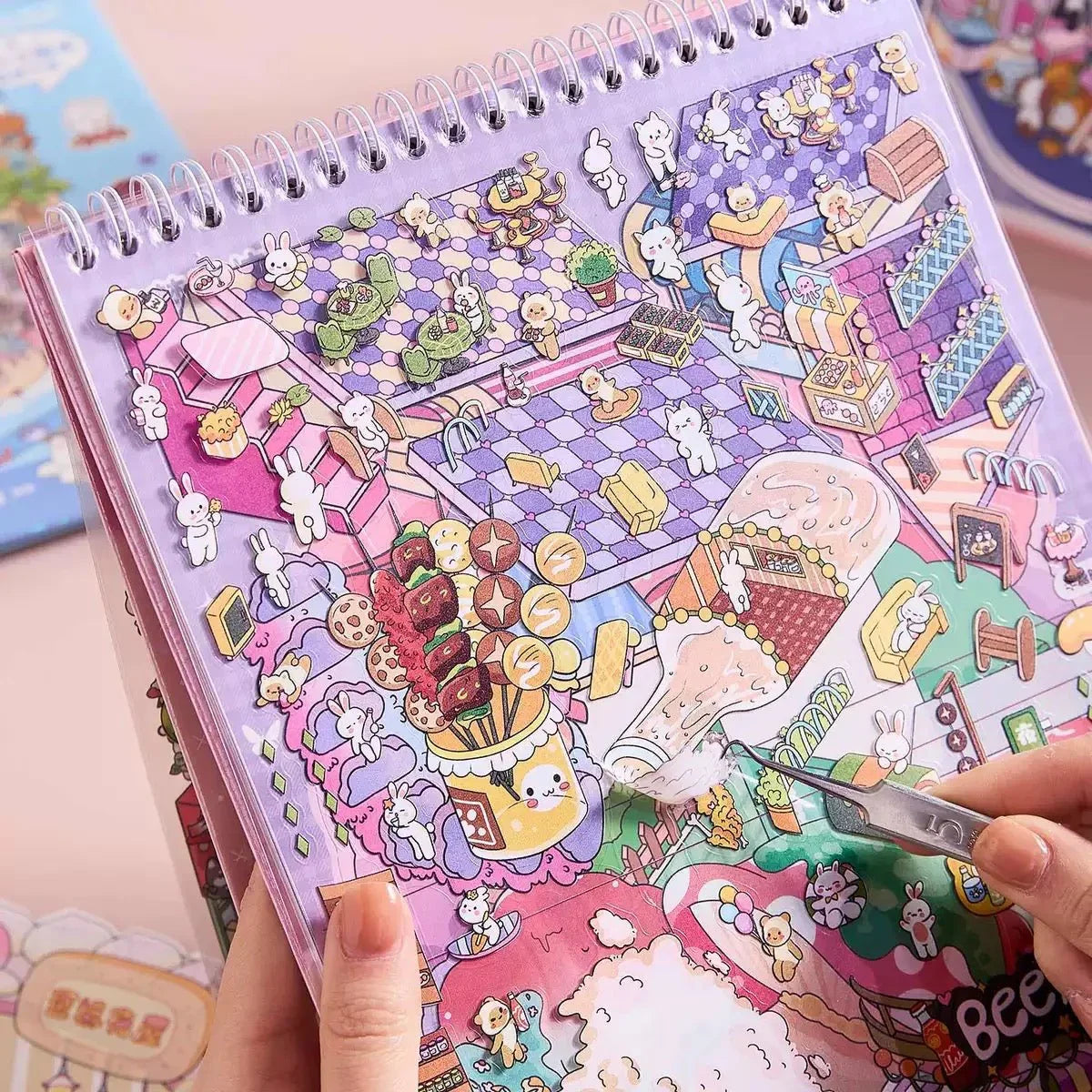 Cute animal scene stickers arranged on a pastel spiral notebook, perfect for journaling crafts.