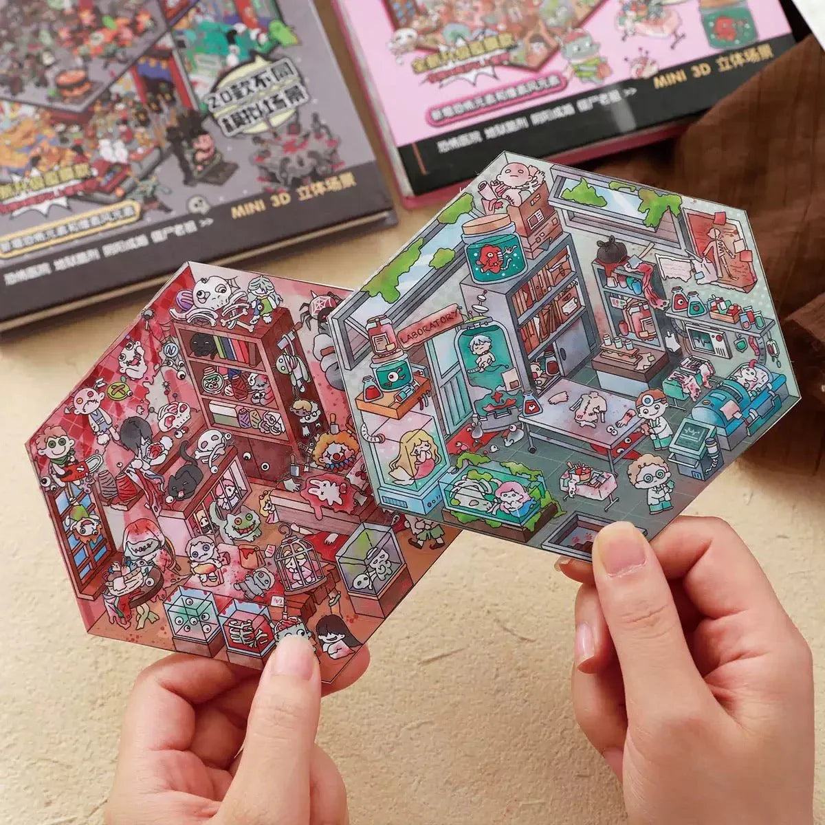 Hands holding two colorful miniature scene stickers with cute cartoon characters, perfect for scrapbooking or journaling.
