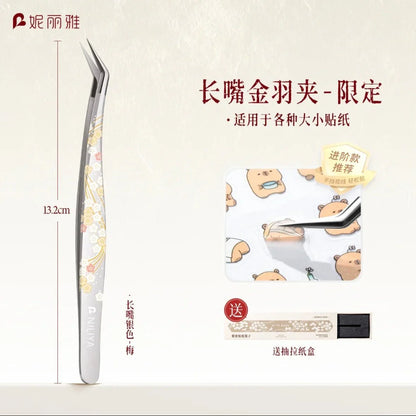 Long angled precision tweezers with floral pattern, perfect for picking up small stickers.