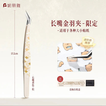Long angled precision tweezers with gold pattern for picking up small stickers, 13.2cm length