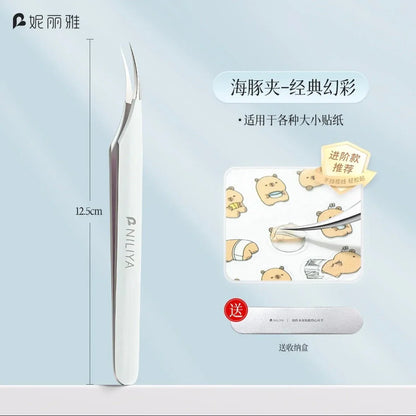 Curved tip silver tweezers for stickers, shown with cute animal sticker sheet and case.