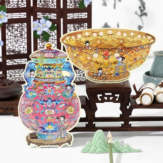 Vintage-style decorative stickers of a golden jade bowl and colorful ruyi vase with cartoon figures, displayed on a wooden stand.