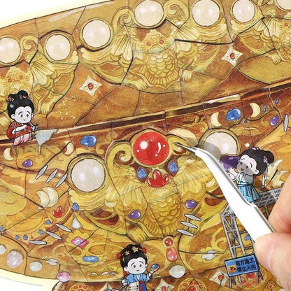 Hand using tweezers to peel cartoon restoration stickers from ornate golden jade bowl design