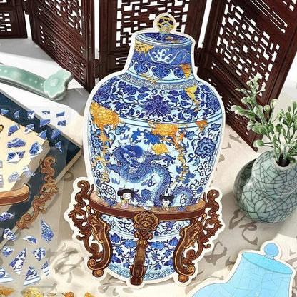 Blue and white porcelain dragon vase sticker with gold accents and wooden stand for journaling