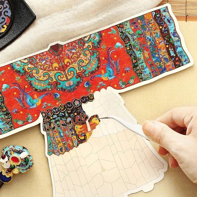 Hand placing stickers on a colorful vintage imperial dance dress craft kit